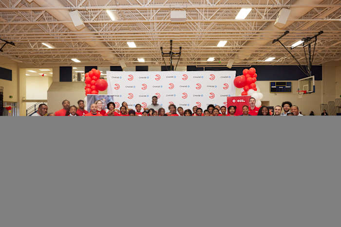 Kids pose at Atlanta Hawks basketball camp.